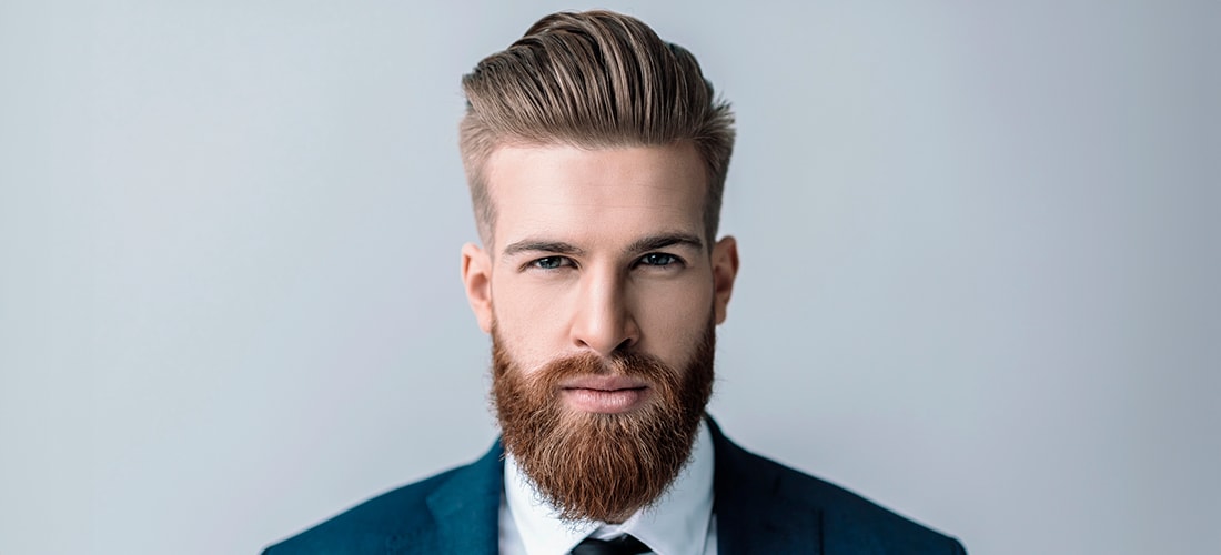 A man with a long, well-groomed beard